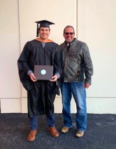 Online MBA graduate Cade Ratliff poses at his graduation