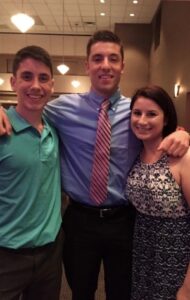 BGSU Online MBA graduate Brett Michael with his family